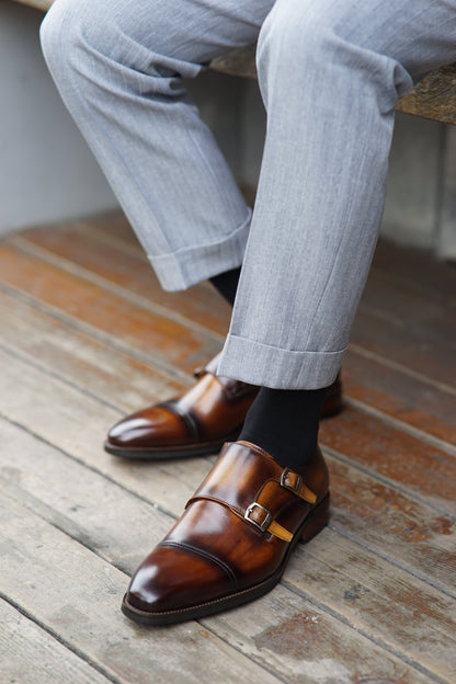 Handmade Brown Double Monk Strap Dress Shoes – worn by a man in cuffed grey trousers, emphasizing the rich patina and modern elegance.