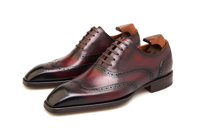 Luxury handcrafted burgundy Oxford brogue dress shoes – leather finish top-down angled view