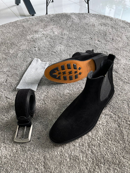 Handmade Classic Black Suede Chelsea Boots – one boot is positioned to highlight the distinctive orange EVA sole.