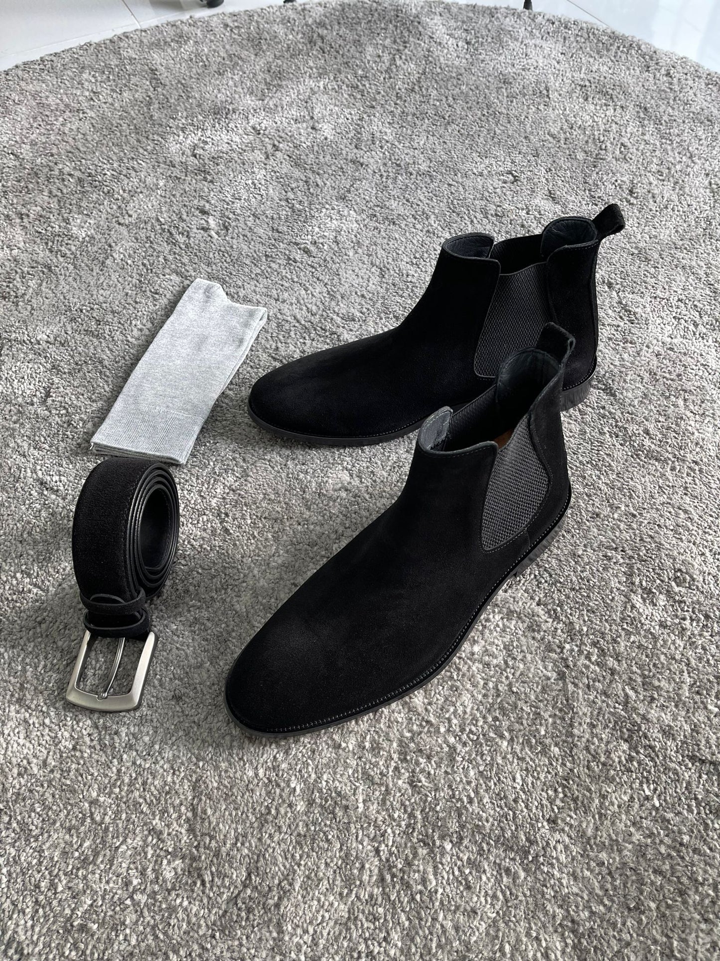 Handmade Classic Black Suede Chelsea Boots – a pair of black suede Chelsea boots from a top-down angle, showing the elastic side panels.