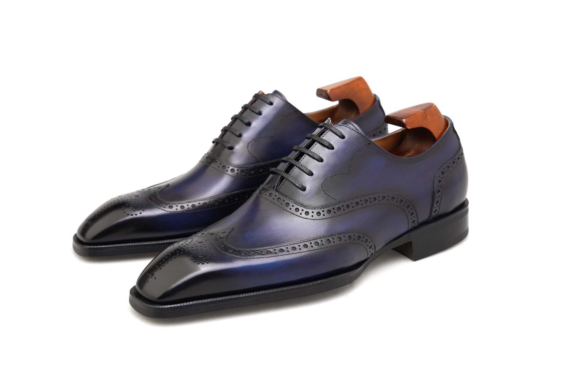 Luxury men’s dress shoes midnight blue wingtip Oxford brogues – polished studio side profile