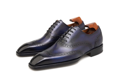 Luxury men’s dress shoes midnight blue wingtip Oxford brogues – polished studio side profile