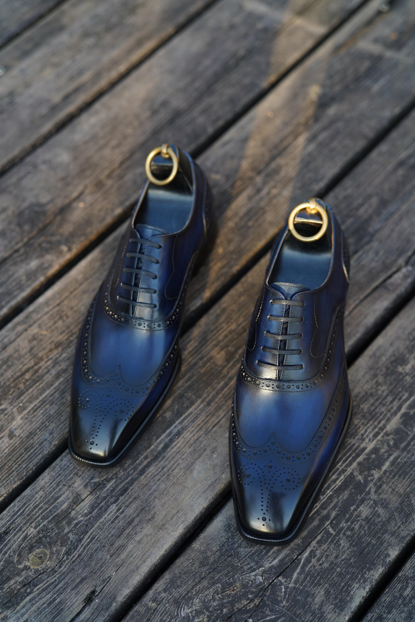 Handcrafted midnight patina Oxford wingtip brogues – top-down leather finish view
