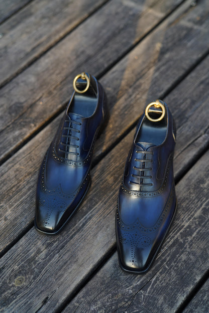 Handcrafted midnight patina Oxford wingtip brogues – top-down leather finish view

