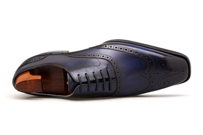 Handcrafted men’s Oxford wingtip brogues in midnight leather – angled top-view detail