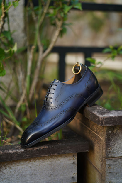 Artisan-crafted midnight patina Oxford dress shoes – sleek side-on profile