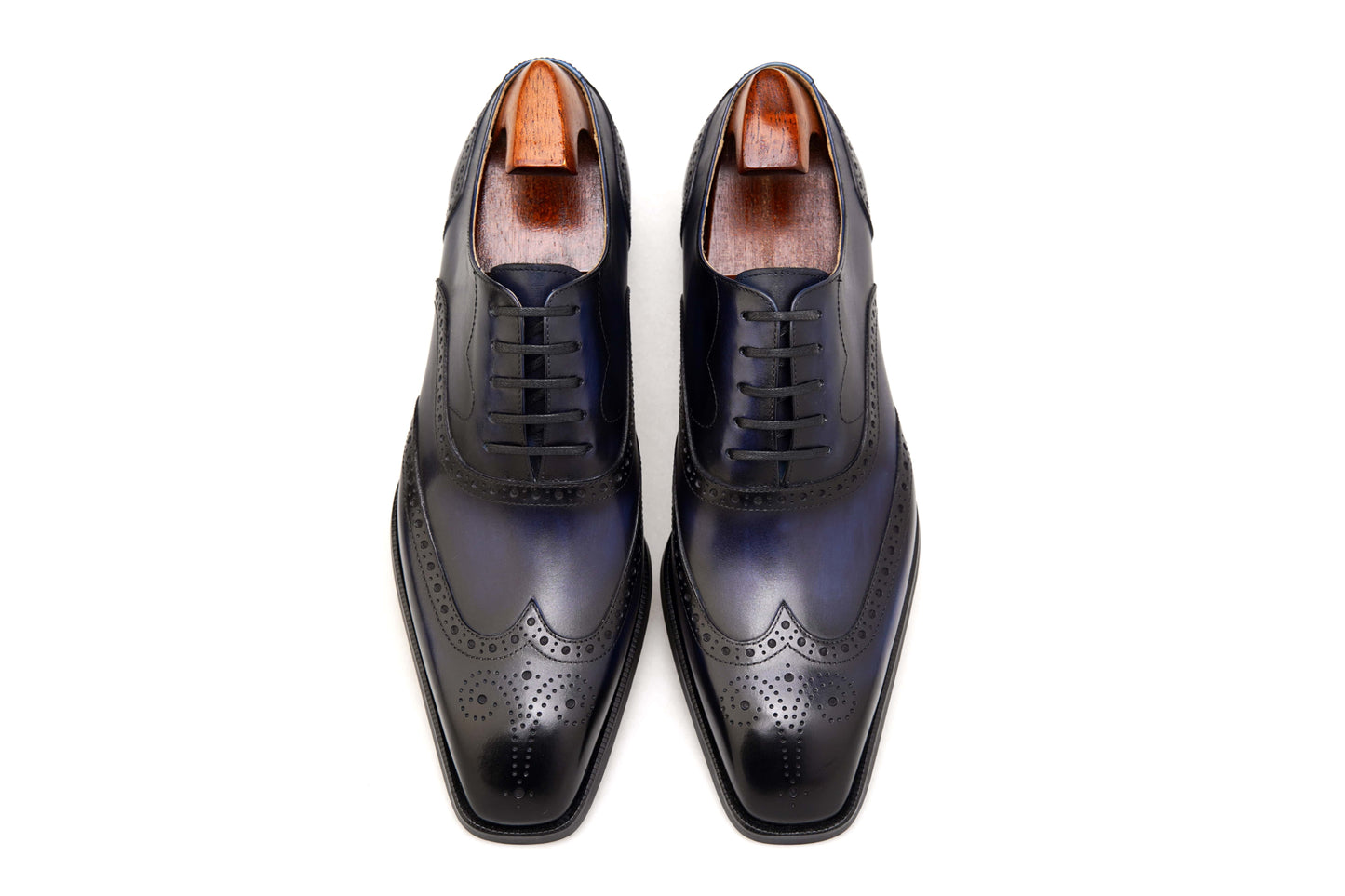 Luxury men’s dress shoes midnight blue wingtip Oxford brogues – polished studio side profile