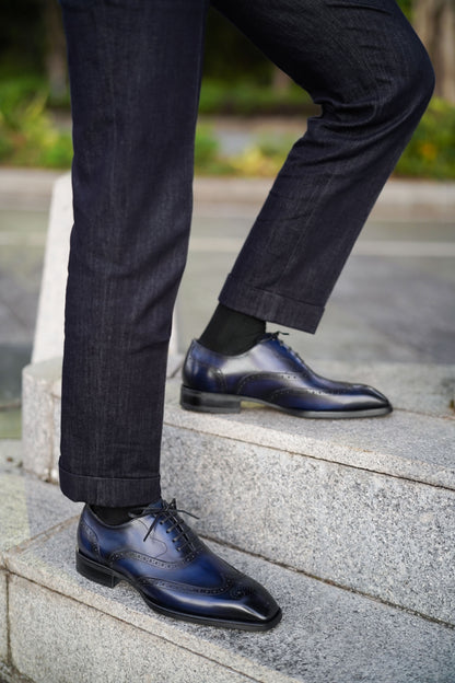 Men’s handcrafted midnight leather wingtip Oxford brogues – lifestyle top-down fashion shot