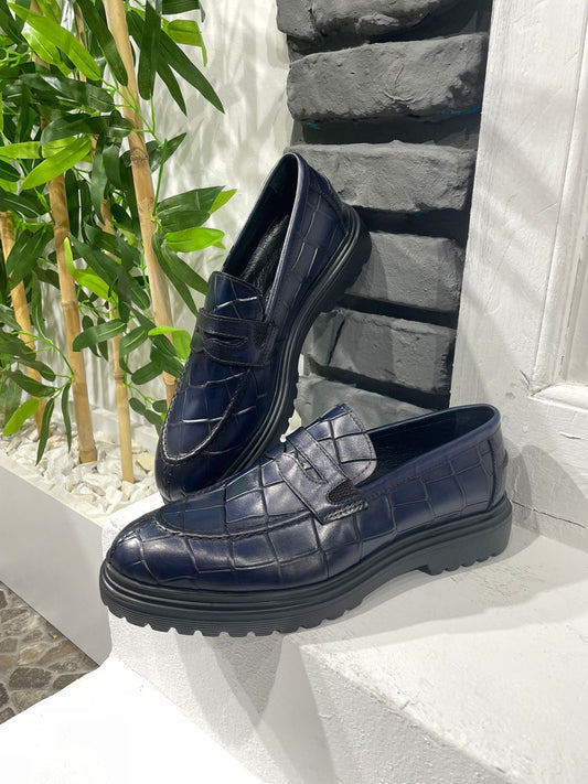 Handmade Navy Blue Crocodile-Embossed Leather Penny Loafers – sophisticated shoes on a white ledge, crafted from luxurious crocodile-embossed leather and a contemporary chunky sole.