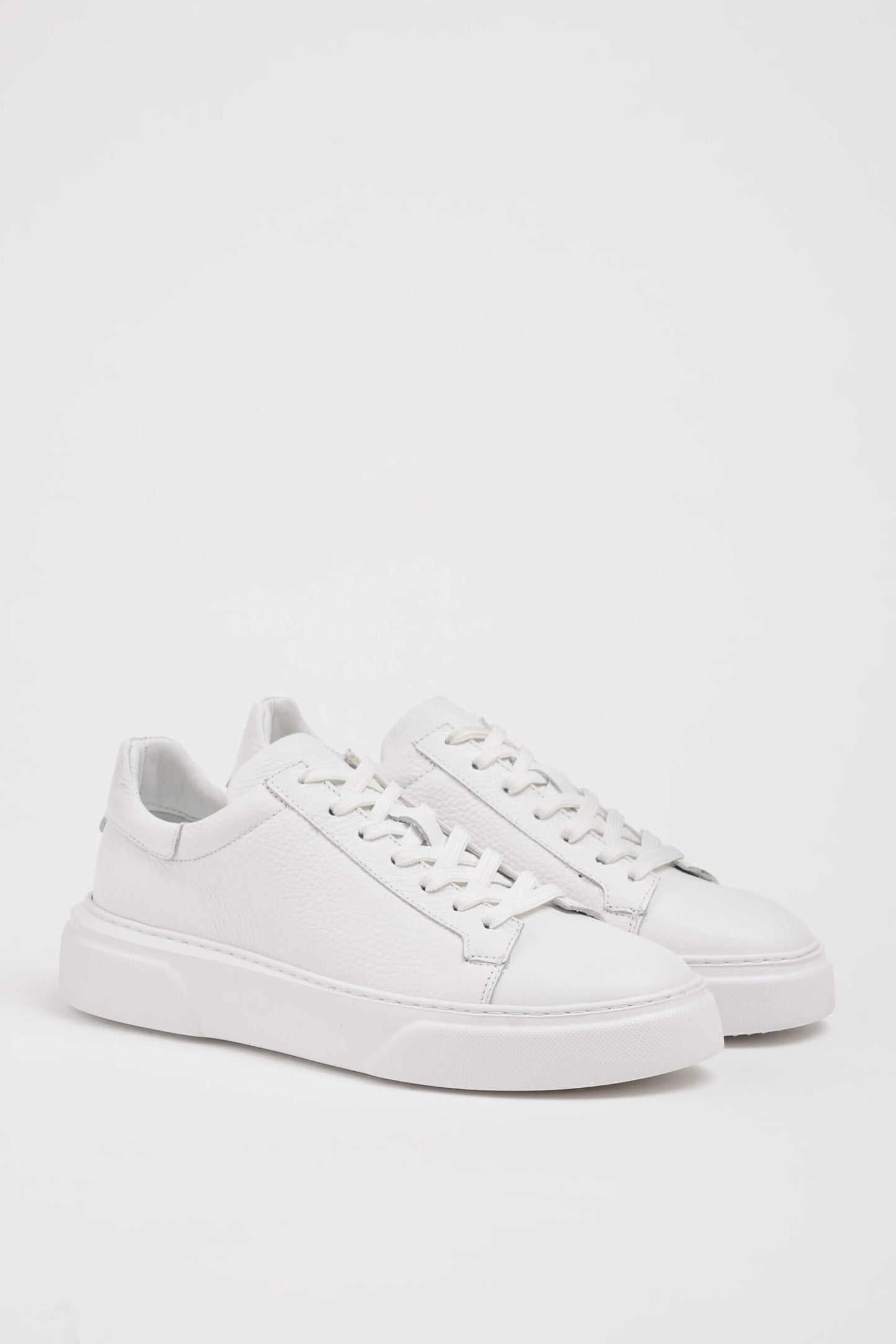 HolloShoe All White Grained Leather Sneakers - Minimalist Style – pair on a white background, showcasing rich black leather and sleek silhouette.