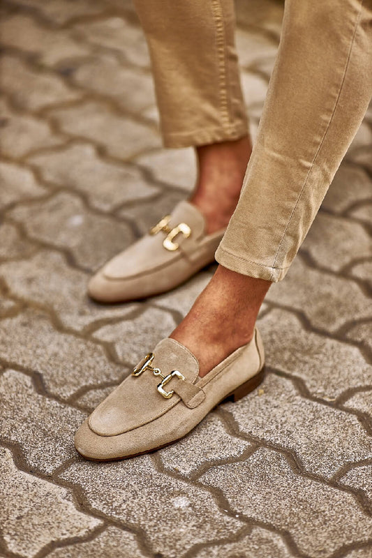 HolloShoe Beige Suede Horsebit Loafers for Stylish Men – worn by a man in tan chinos, standing on a paved ground, showcasing sophisticated buckle detail and Eva rubber sole. 