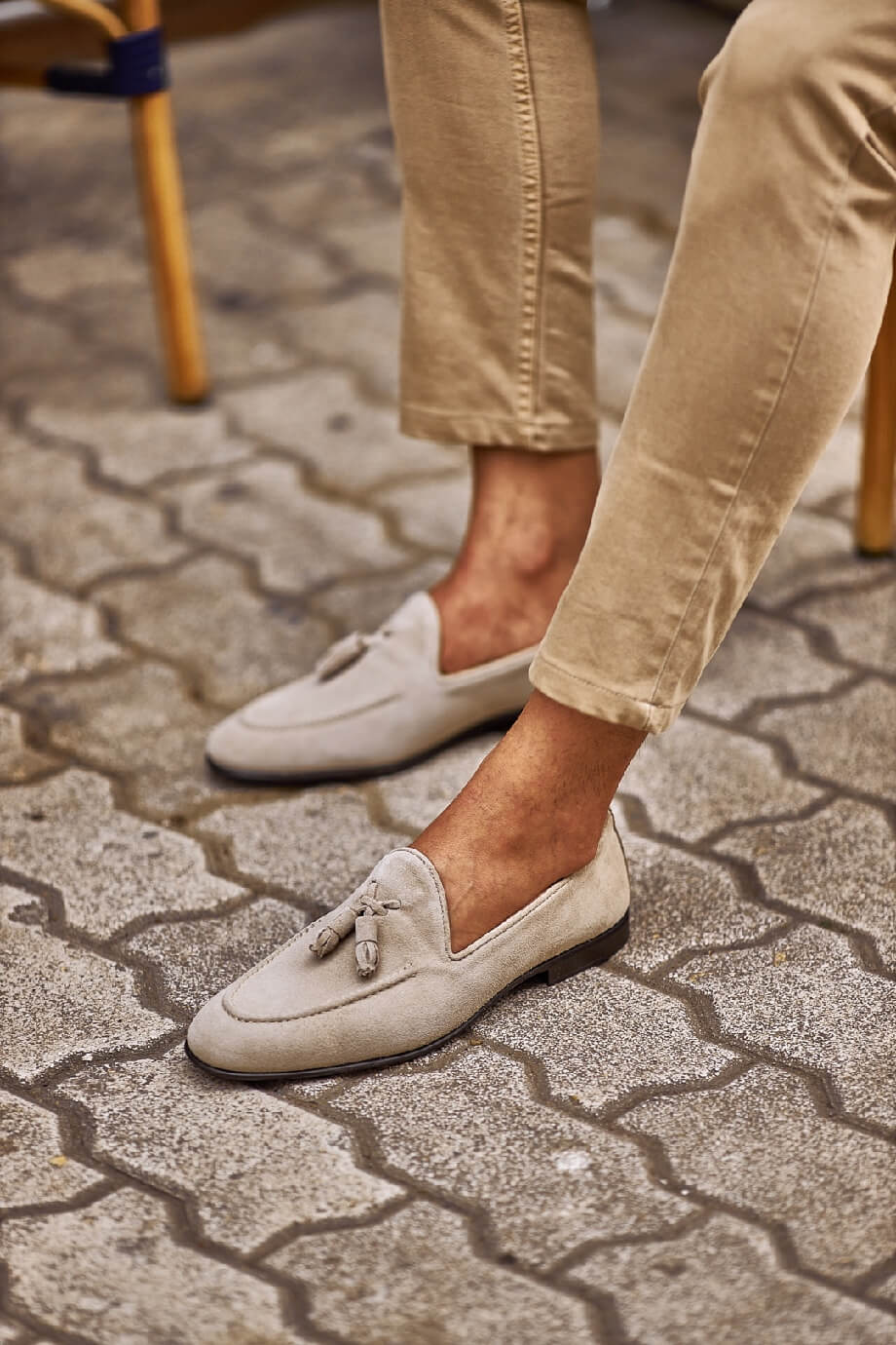 HolloShoe Beige Suede Tassel Loafers - Sophisticated Leather Footwear – worn by a man in tan chinos, standing on a paved ground, highlighting sophisticated tassel design and Eva rubber sole.