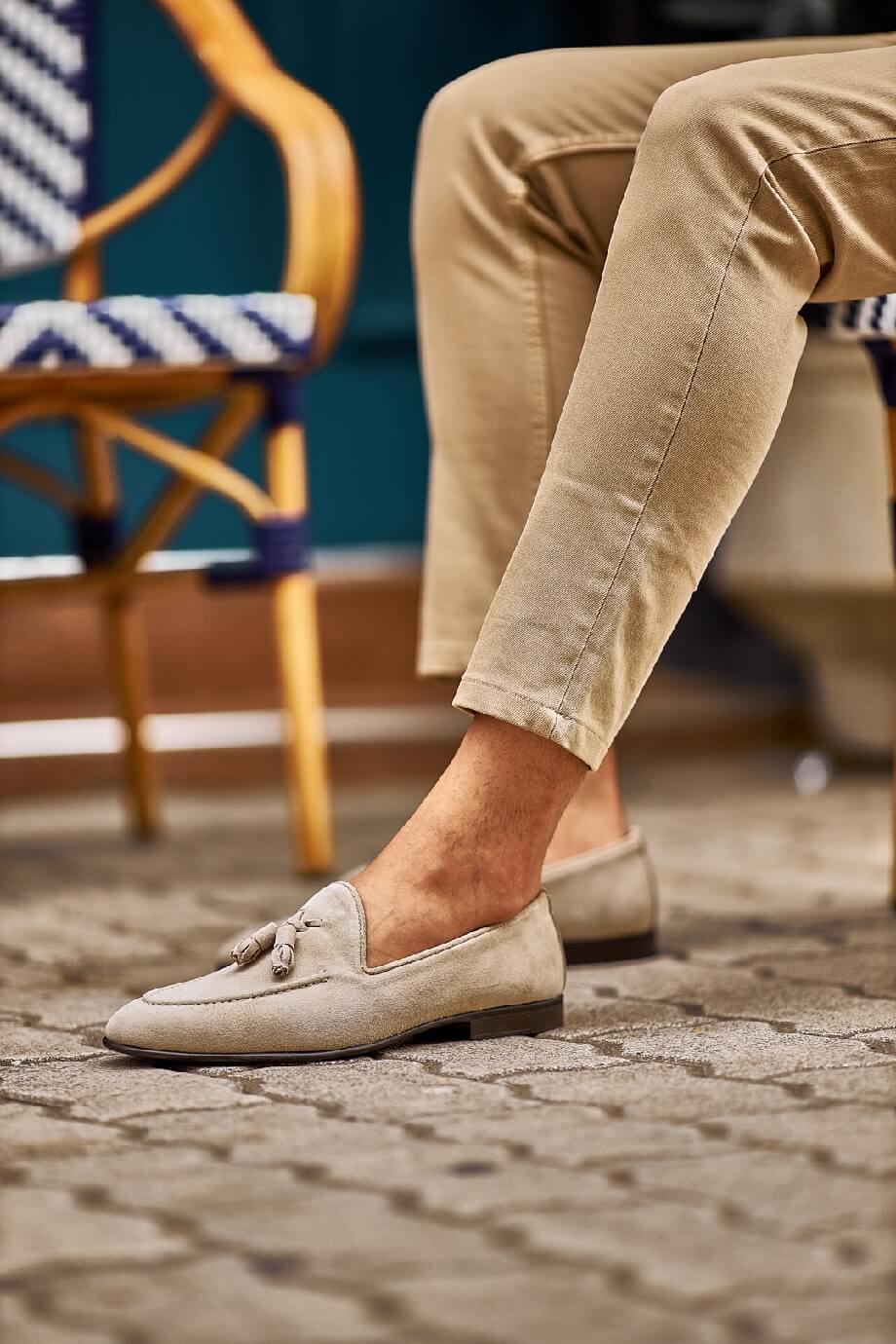 HolloShoe Beige Suede Tassel Loafers - Sophisticated Leather Footwear – worn by a man in tan chinos, sitting in a chair, showcasing timeless elegance and versatility.