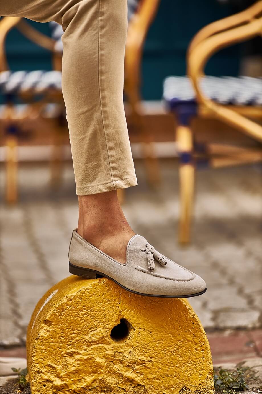 HolloShoe Beige Suede Tassel Loafer - Sophisticated Leather Footwear – worn by a man in tan chinos, standing on a yellow concrete block, highlighting the high-quality suede leather and timeless style.