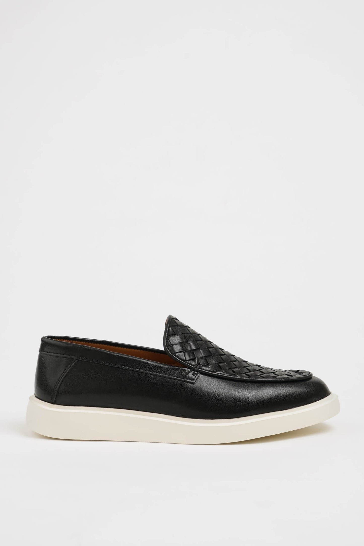 HolloShoe Black Leather Casual Shoes with Knitted Detail – side view, displaying a sleek slip-on design with a unique knitted texture and comfortable sole.