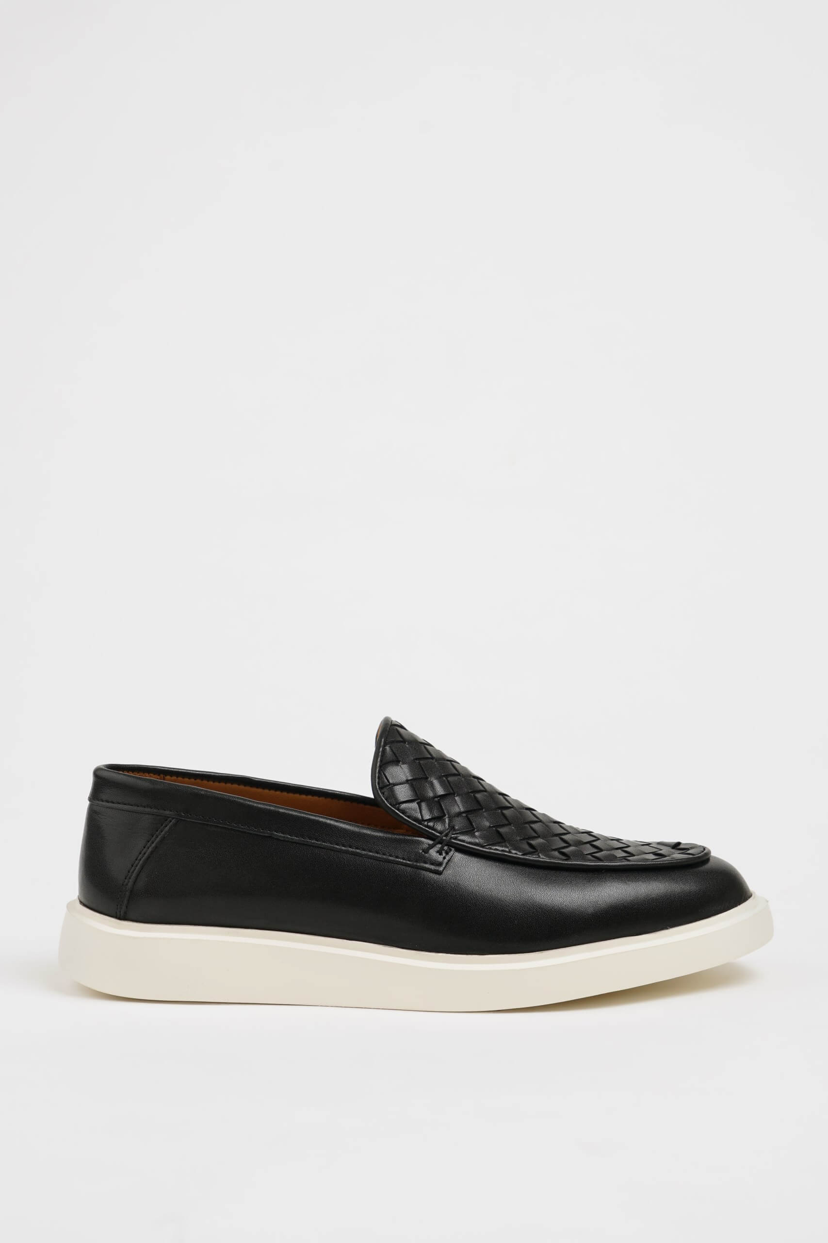 HolloShoe Black Leather Casual Shoes with Knitted Detail – side view, displaying a sleek slip-on design with a unique knitted texture and comfortable sole.