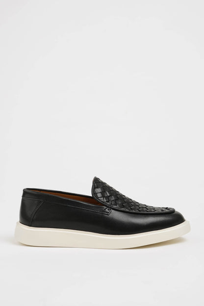HolloShoe Black Leather Casual Shoes with Knitted Detail – side view, displaying a sleek slip-on design with a unique knitted texture and comfortable sole.