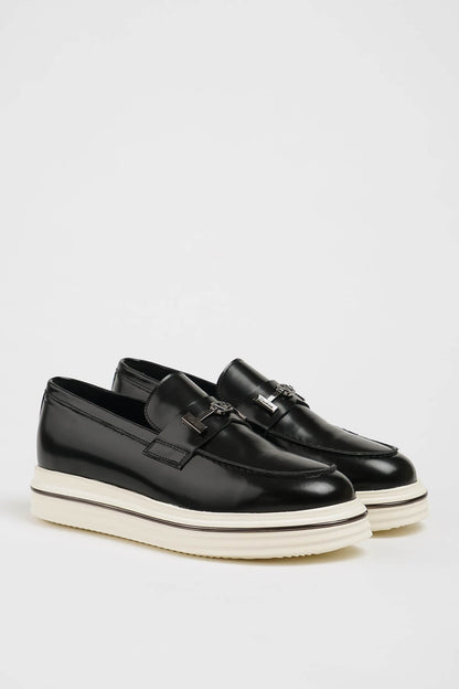 HolloShoe Black Leather Slip-On Loafers with Horsebit Detailing – pair on a white background, highlighting a sleek silhouette and polished finish with a distinctive silver-toned horsebit detail.