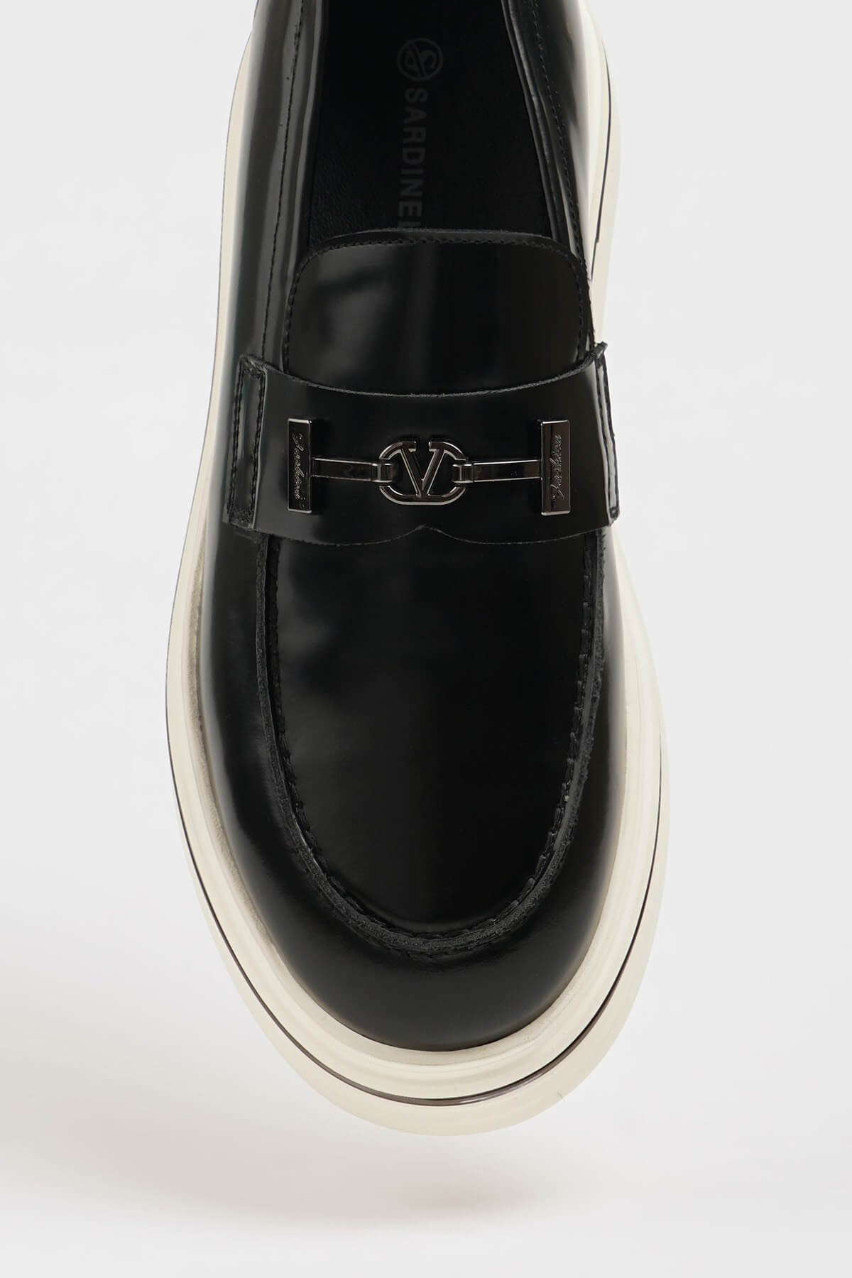 HolloShoe Black Leather Slip-On Loafer – close-up top-down view, showcasing 100% genuine black leather and a distinctive silver-toned horsebit detail.



