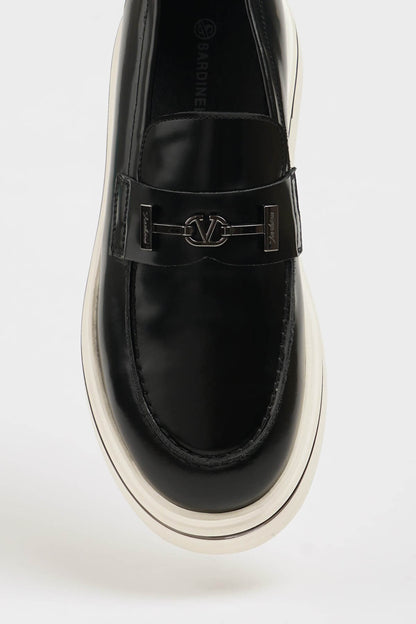 HolloShoe Black Leather Slip-On Loafer – close-up top-down view, showcasing 100% genuine black leather and a distinctive silver-toned horsebit detail.


