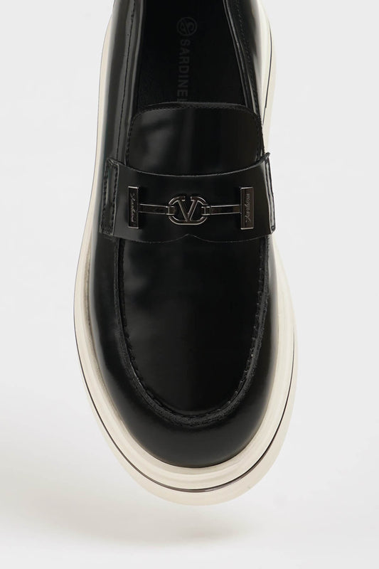 HolloShoe Black Leather Slip-On Loafer – close-up top-down view, showcasing 100% genuine black leather and a distinctive silver-toned horsebit detail.


