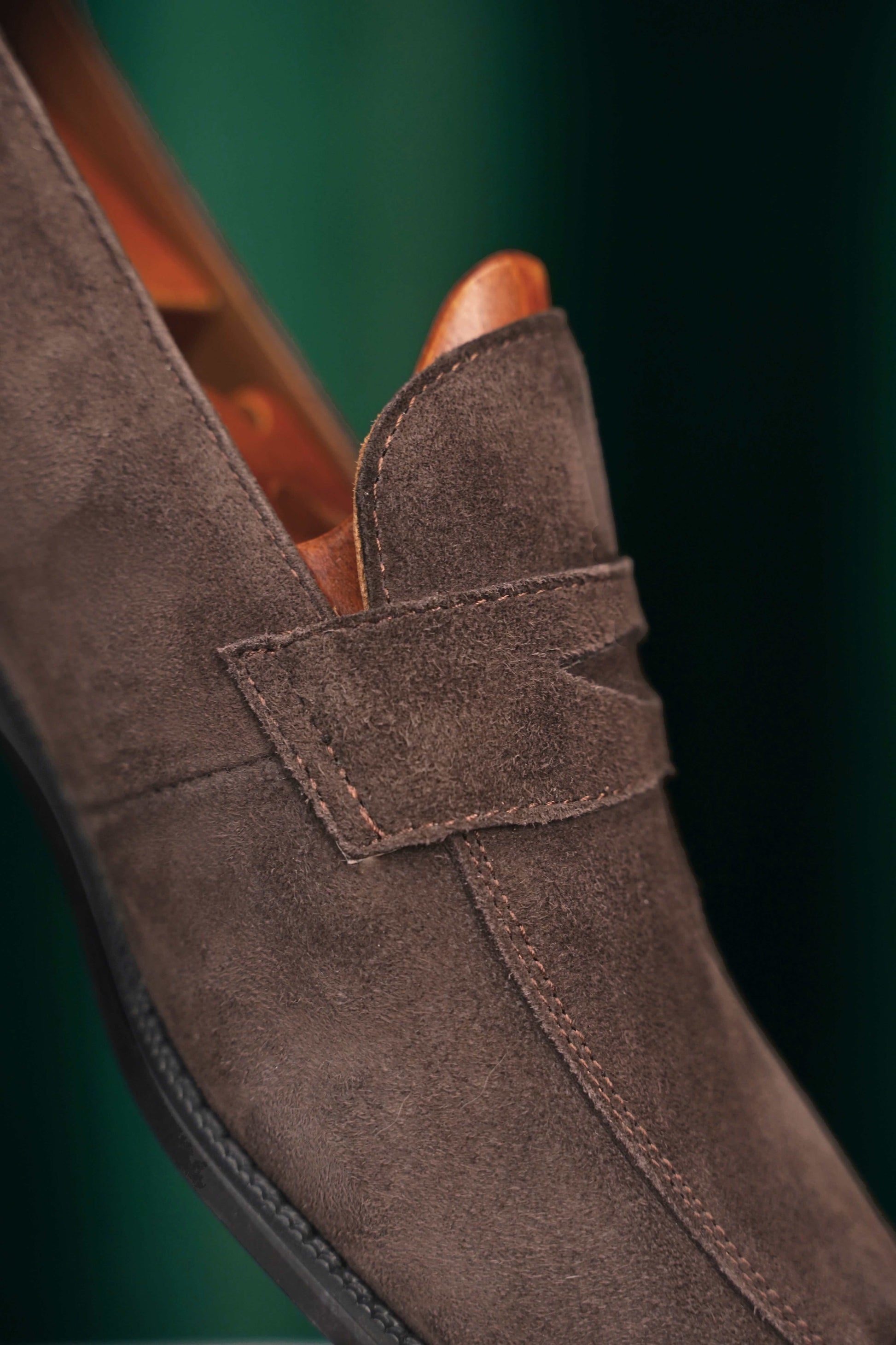 Earth Brown Suede Penny Loafer – close-up of the penny strap and soft suede texture, emphasizing classic character and refined minimalism.