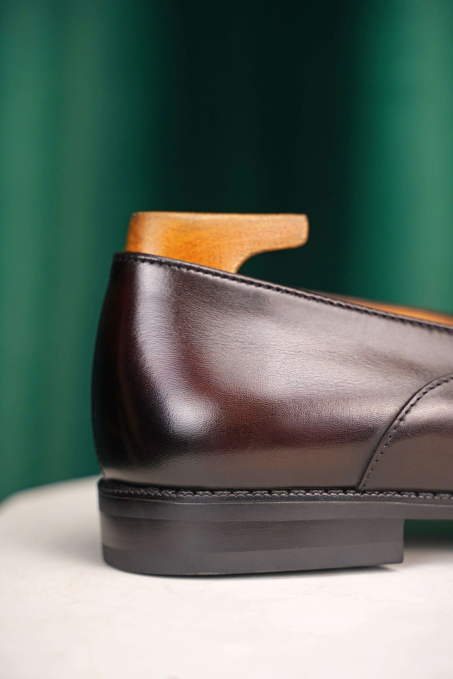 HolloShoe Handmade Dark Tan Leather Penny Loafers – close-up of the elegant stitching and rich dark tan leather texture, emphasizing sophisticated craftsmanship.