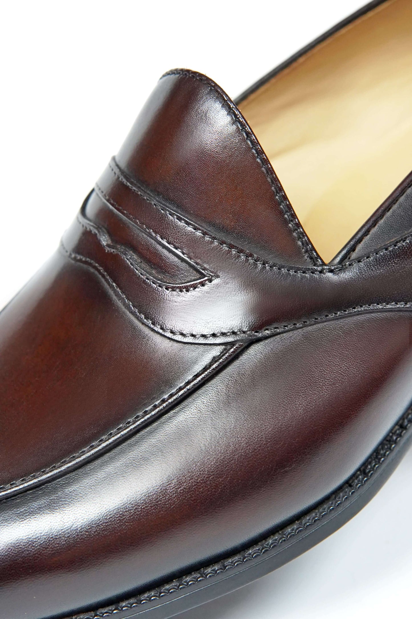 HolloShoe Handmade Dark Tan Leather Penny Loafer – close-up of the elegant penny strap and rich dark tan leather, emphasizing sophisticated craftsmanship.