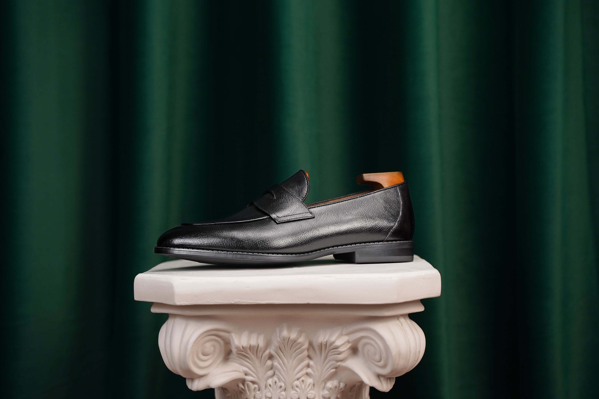 HolloShoe Black Penny Loafer – top-down view, showcasing textured black leather, penny slot, and sleek design.