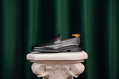 HolloShoe Black Penny Loafer – top-down view, showcasing textured black leather, penny slot, and sleek design.
