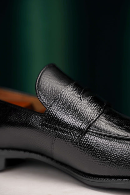 Sophisticated Black Penny Loafers – Dress Shoes for Modern Professionals – close-up of textured full-grain black leather upper with polished toe and refined penny slot detail.