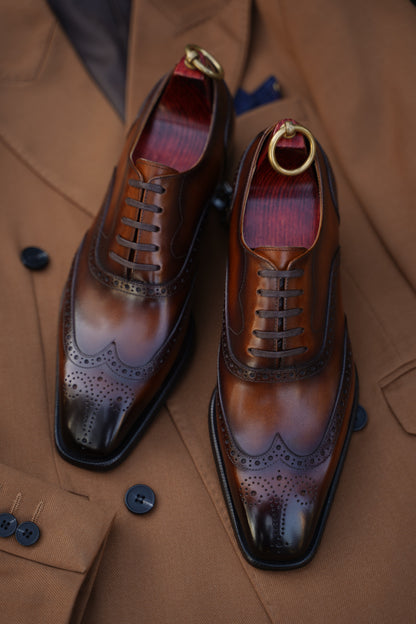Handcrafted brown leather wingtip Oxford brogues – close‑up top view