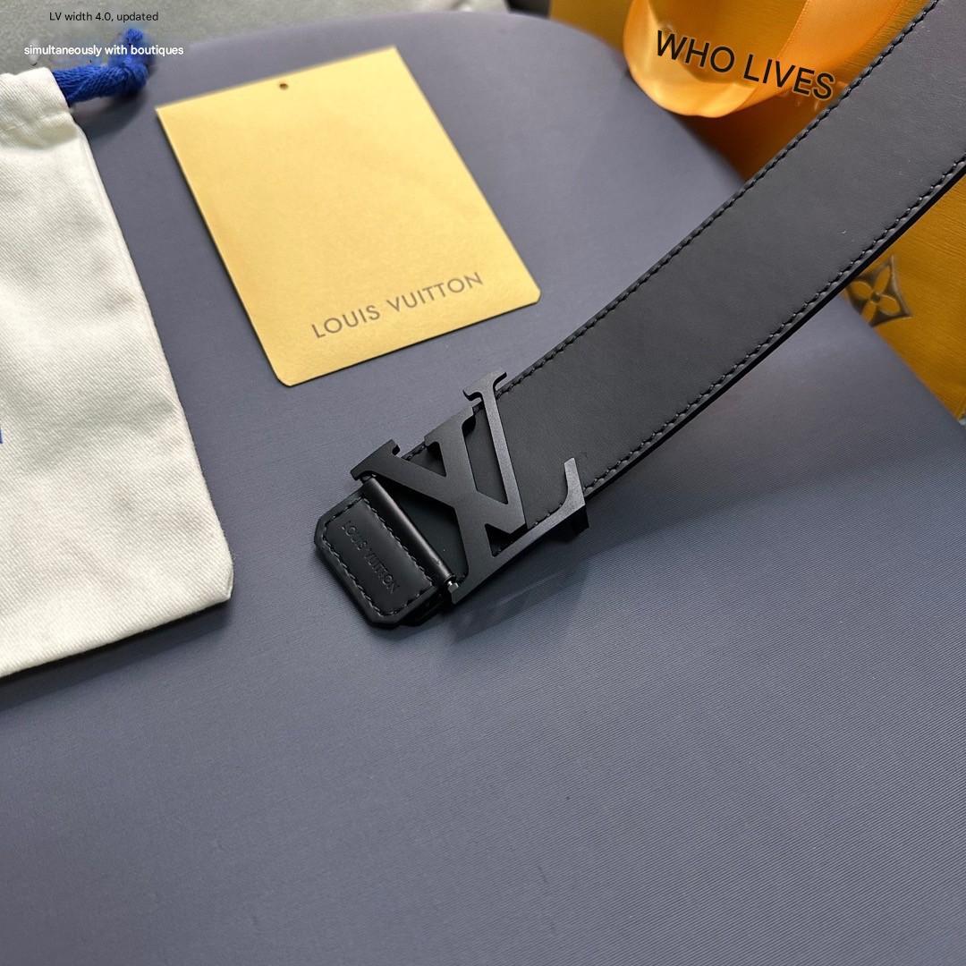 Black belt with a prominent buckle on a gray surface, with 'Louis Vuitton' branding visible.