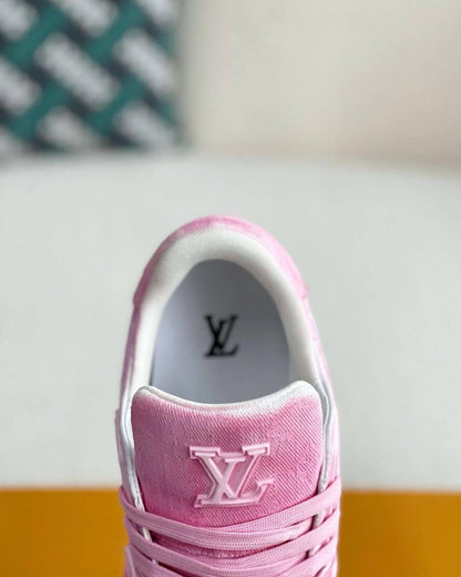 Louis Vuitton LV Trainer Sneaker in vibrant pink with monogram pattern, featuring premium leather and suede materials.