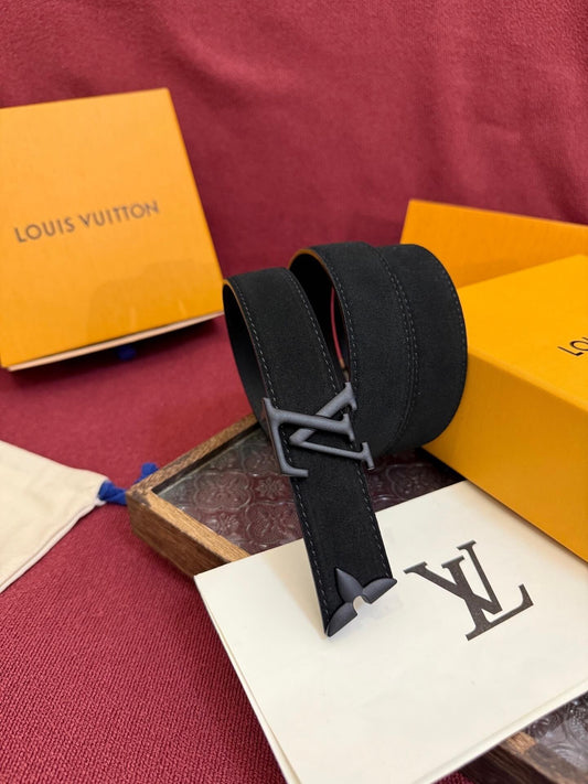 Black belt with silver buckle on a Louis Vuitton box and paper with logo.