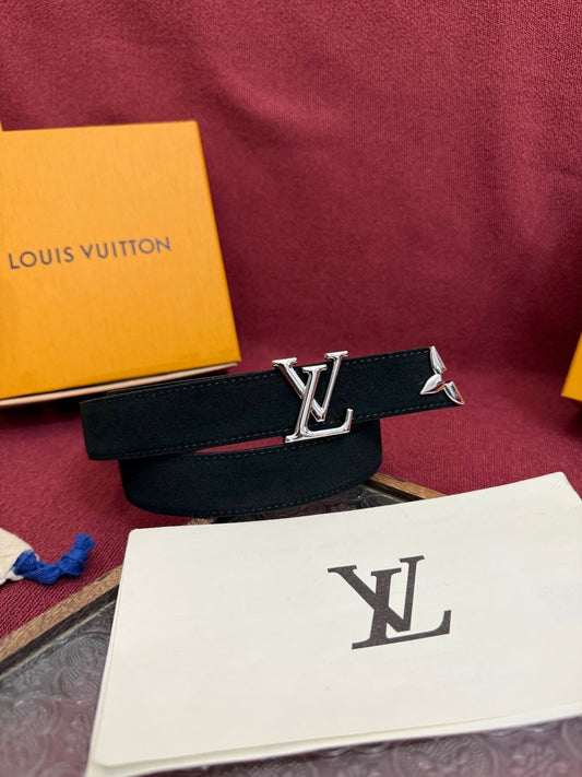 Louis Vuitton belt with logo on a red fabric background