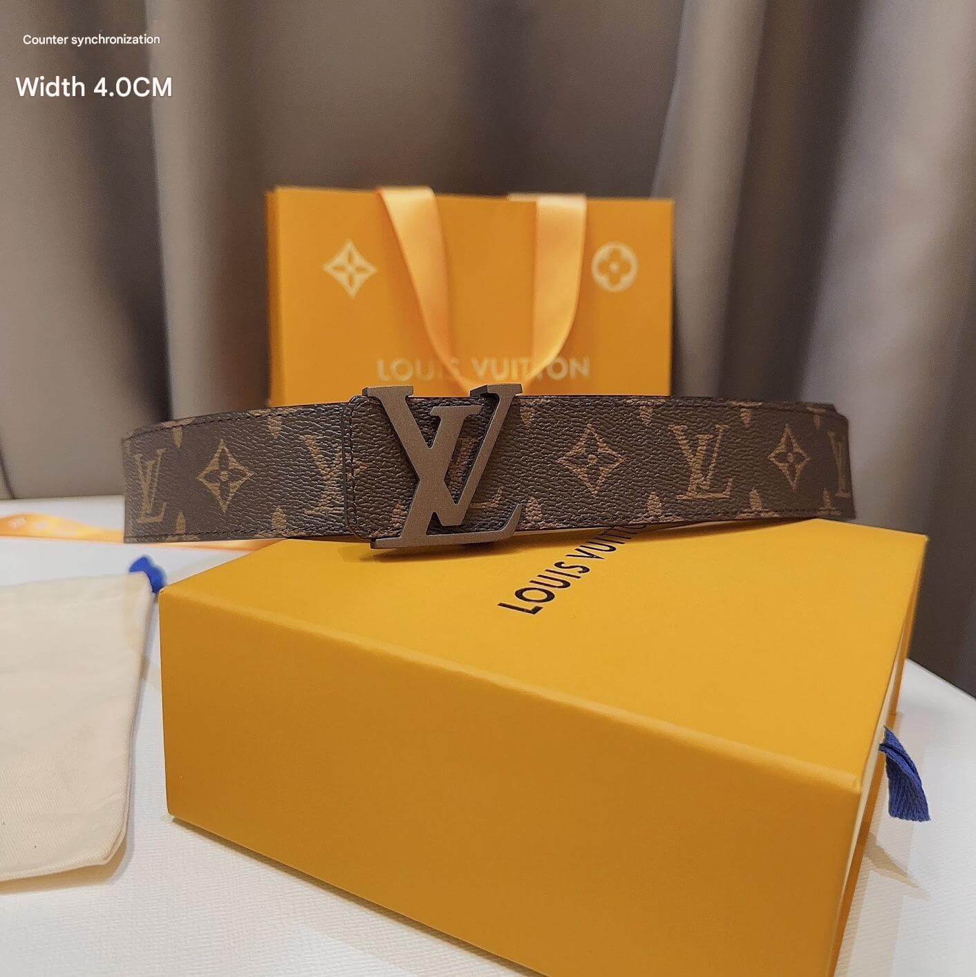 Louis Vuitton belt on a yellow box with a brown background