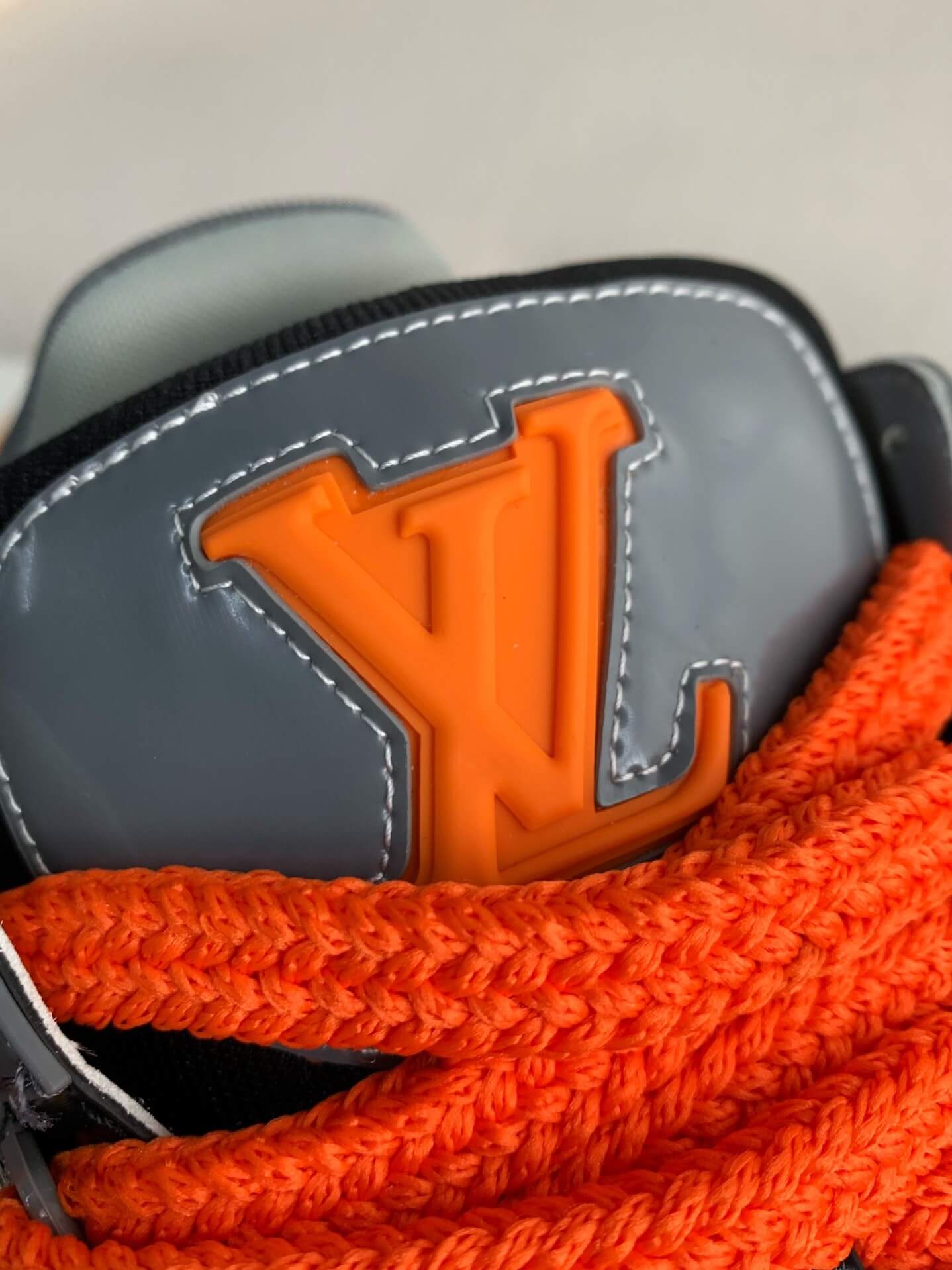 Louis Vuitton LV Maxi Trainer – Grey & Black Patent Leather with Orange Accents