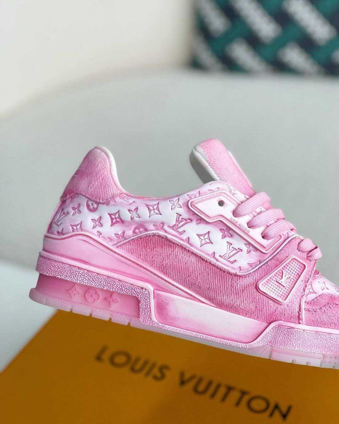 Louis Vuitton LV Trainer Sneaker in vibrant pink with monogram pattern, featuring premium leather and suede materials.