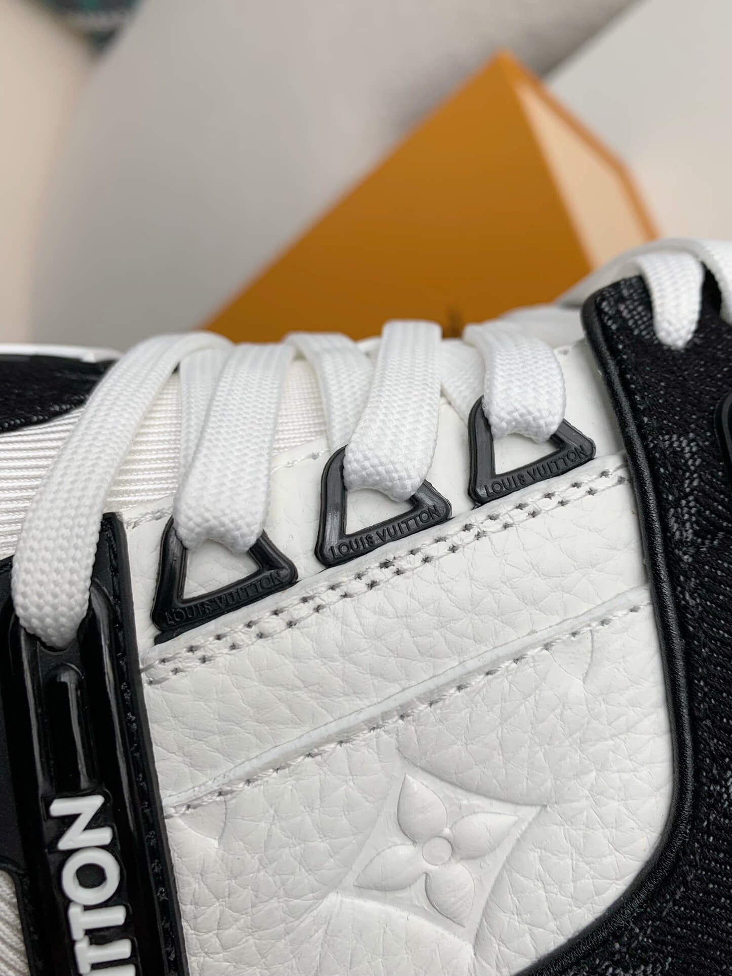Louis Vuitton Trainer Sneaker – Black & White Monogram Denim with Embossed Grained Leather