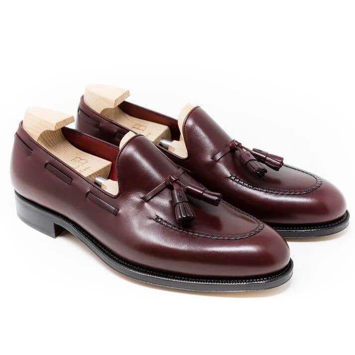 Luxurious Italian Marble Patina Tassel Loafers – pair on a white background, showcasing stunning burgundy leather and classic tassel detail.