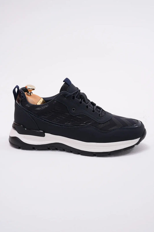 Midnight Motion Luxe Sneaker for Urban Energy – side view of one shoe with a shoe tree, highlighting premium midnight blue leather with subtle geometric texture and a lightweight EVA sole.