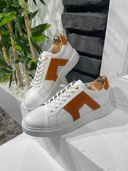 Modern White Orange Sneakers for Everyday Casual Wear – pair on a white ledge, highlighting a modern take on classic design with a clean white leather upper.