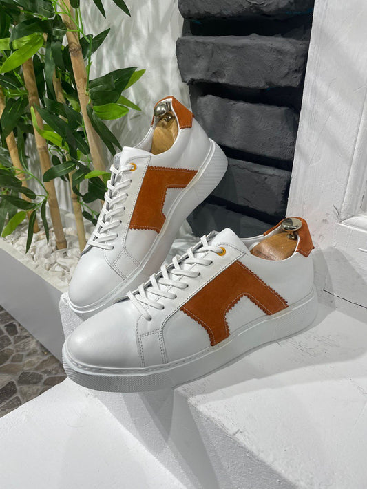 Modern White Orange Sneakers for Everyday Casual Wear – pair on a white ledge, highlighting a modern take on classic design with a clean white leather upper.