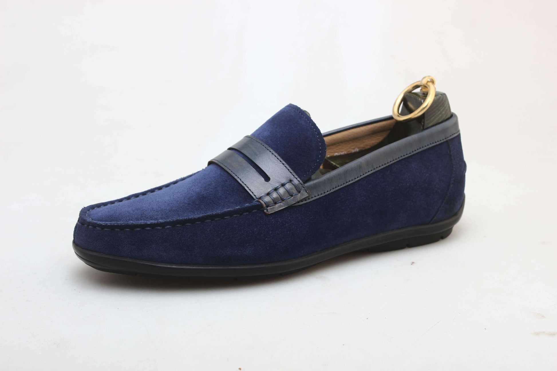 Men's dress loafers in blue suede with a penny strap, featuring a contrast trim and rubber sole.