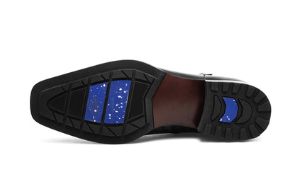 Premium Black Leather Zip-Up Ankle Boots for Formal Wear – an under-sole view of a single boot, showing the durable rubber sole and speckled blue inserts.