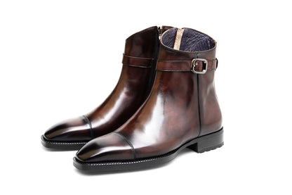 Premium Brown Leather Ankle Boots for Urban Adventures – a straight-on shot of the pair of brown leather boots on a white background, highlighting the side zip and buckle.