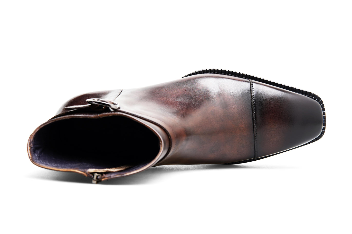 Premium Brown Leather Ankle Boots for Urban Adventures – shot of the pair of boots on a gray textured background, highlighting the sleek silhouette.