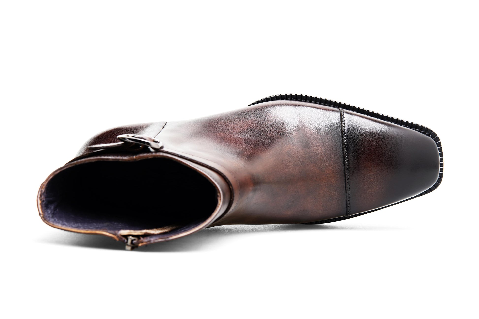 Premium Brown Leather Ankle Boots for Urban Adventures – shot of the pair of boots on a gray textured background, highlighting the sleek silhouette.