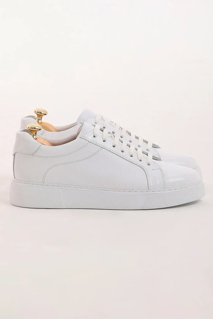 Pristine Luxe White Leather Sneakers - Luxury Comfort for Every Occasion – side view of pair, showcasing 100% genuine leather and a lightweight EVA sole.